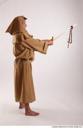 JOEL_ADAMSON STANDING POSE WITH SWORD AND CRUCIFIX